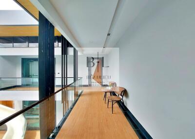 Modern corridor with seating area and large windows