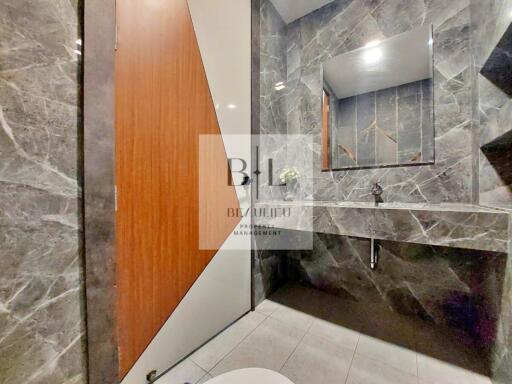 Modern bathroom with stylish marble tiles