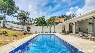 Luxury outdoor pool area with lounge seating