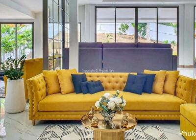 Modern living room with yellow sofa and decorative pillows