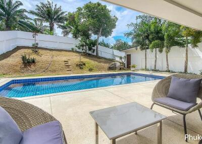 Swimming pool with outdoor seating area