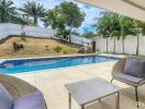 Swimming pool with outdoor seating area