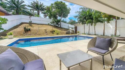 Swimming pool with outdoor seating area