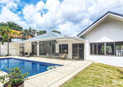 Modern house with swimming pool and patio area