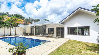 Modern house with swimming pool and patio area