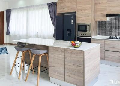 Modern kitchen with an island and advanced appliances