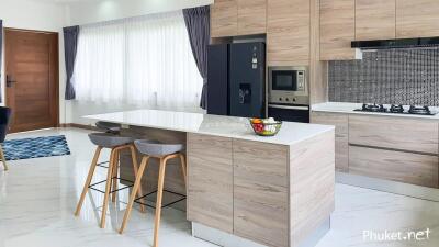 Modern kitchen with an island and advanced appliances