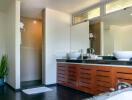 Modern bathroom with double-sink vanity and walk-in shower