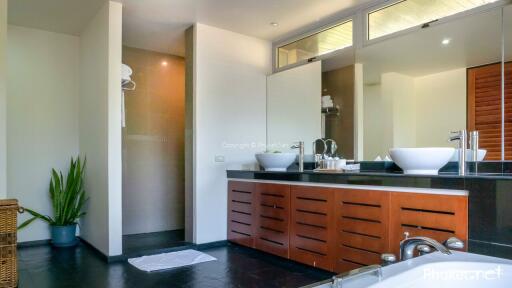 Modern bathroom with double-sink vanity and walk-in shower