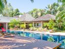 Outdoor area with swimming pool and sun loungers