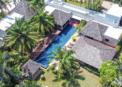 Aerial view of a luxurious residential property with pool