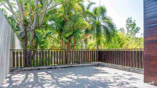 Spacious patio with lush greenery