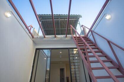 Outdoor staircase leading to a terrace area