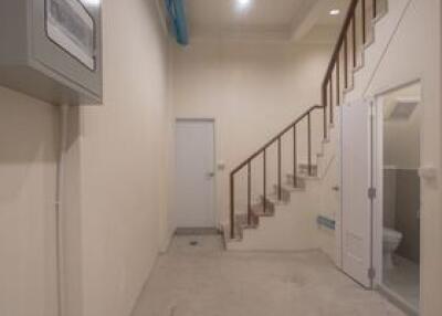 Basement with staircase and utility room