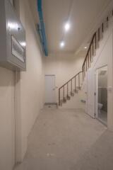 Basement with staircase and utility room