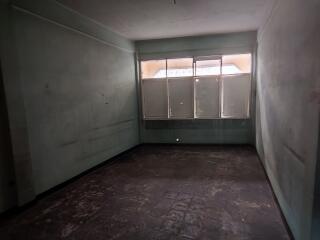 Empty room with large windows