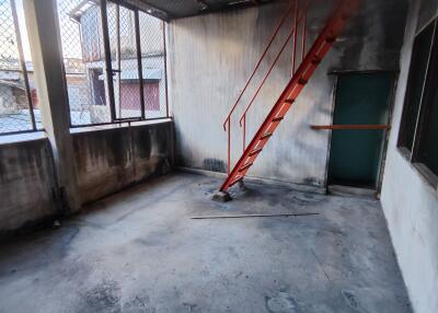 Warehouse with a stairway and metal fence