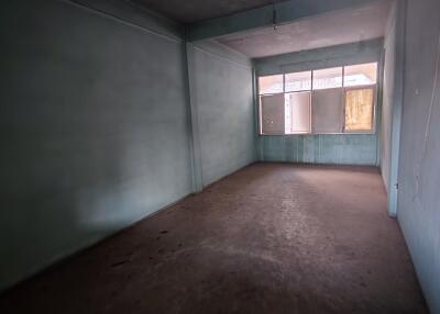 Empty room with large windows