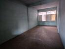 Empty room with large windows