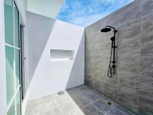 Minimalist outdoor bathroom with shower