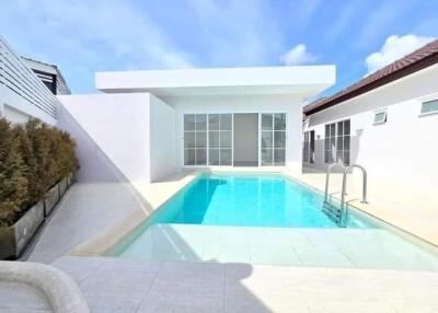 Modern house with a swimming pool and patio area