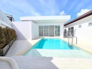 Modern house with a swimming pool and patio area