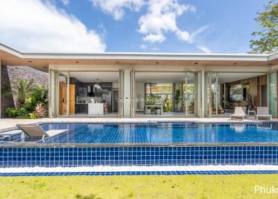 Modern villa with pool and outdoor furniture