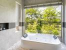 Modern bathroom with large window and jacuzzi tub