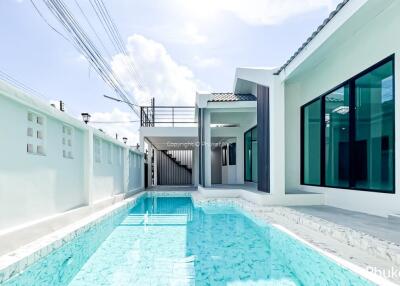 Modern house with swimming pool and white walls
