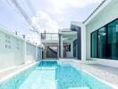 Modern house with swimming pool and white walls