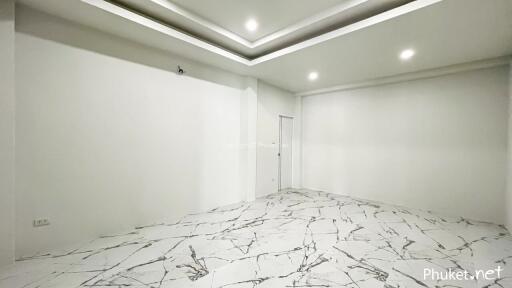 empty room with modern marble tile flooring and recessed ceiling lights