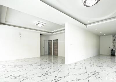 Spacious living room with marble flooring and modern ceiling design