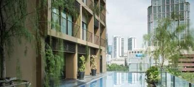 Apartment building with rooftop pool and city view