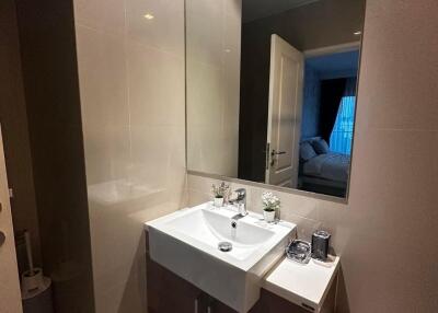 Modern bathroom with a large mirror and sink
