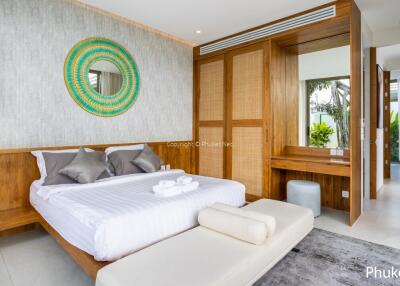 Modern bedroom with wooden elements and decorative mirror