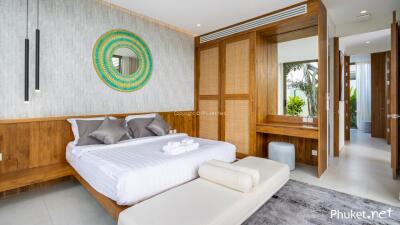 Modern bedroom with wooden elements and decorative mirror