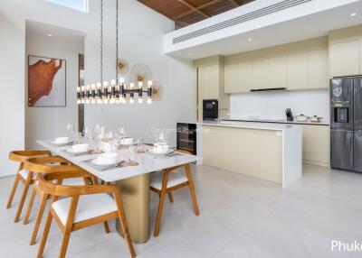 Modern kitchen and dining area with wooden chairs and island