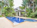 Swimming pool in a lush tropical garden