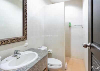 Spacious and clean bathroom with a large mirror