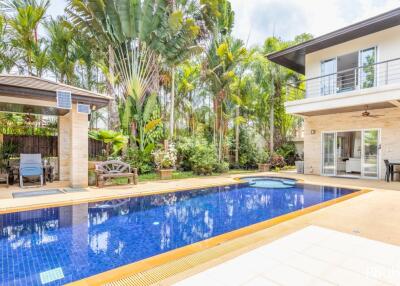 Spacious backyard with pool and poolside seating area