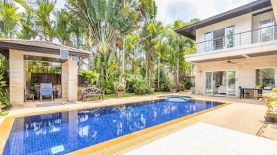 Spacious backyard with pool and poolside seating area