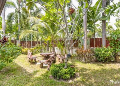 Lush garden with outdoor seating area