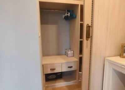 Well-organized closet with storage drawers and shelving