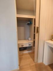 Well-organized closet with storage drawers and shelving