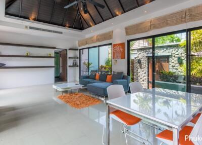 Modern living room with dining area and large windows