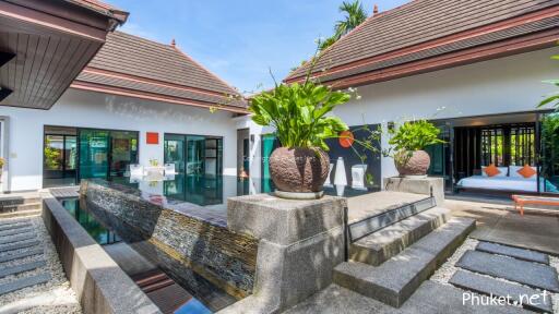 Modern villa with water feature and seating area