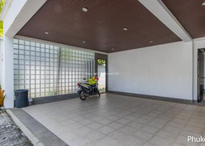 Spacious garage with tiled flooring and natural lighting