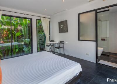 Bedroom with garden view and en-suite bathroom