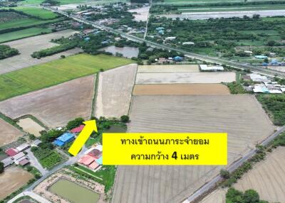 Aerial view of a rural area with fields and houses