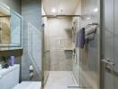 Modern bathroom with glass shower and wall-mounted sink